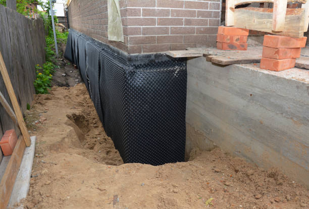 Happy homeowners after waterproofing job in Maple Grove